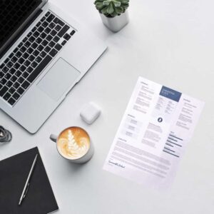 MBA resume review and CV editing for MBA application success – sample professionally edited resume and laptop.